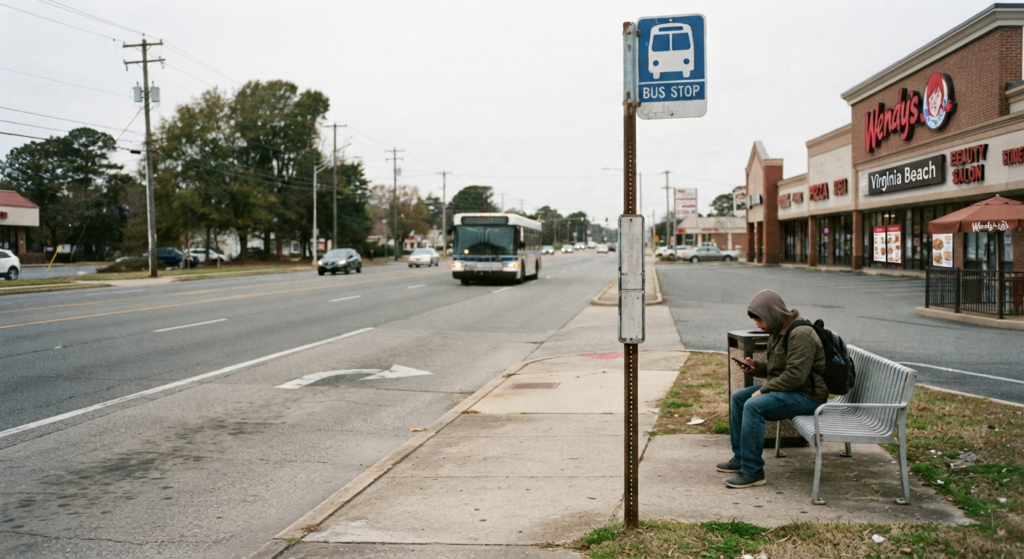 Public bus stop along a commercial corridor near restaurants and shops in Virginia Beach